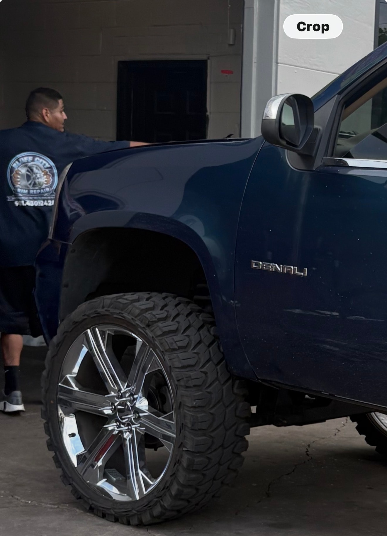 GMC Denali with large chrome wheels at Bluff City